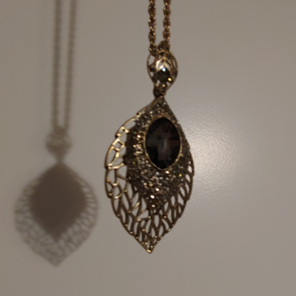 Bejeweled peacock feather necklace